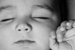 17 B&W Closeup Portrait of Sleeping Baby with eyes nose mouth fingers.jpg